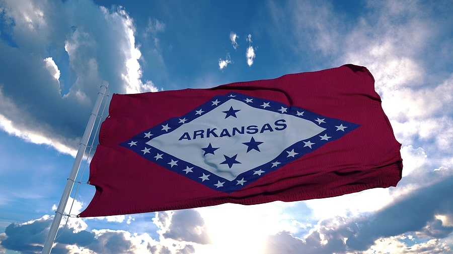 Arkansas flag waving in blue sky