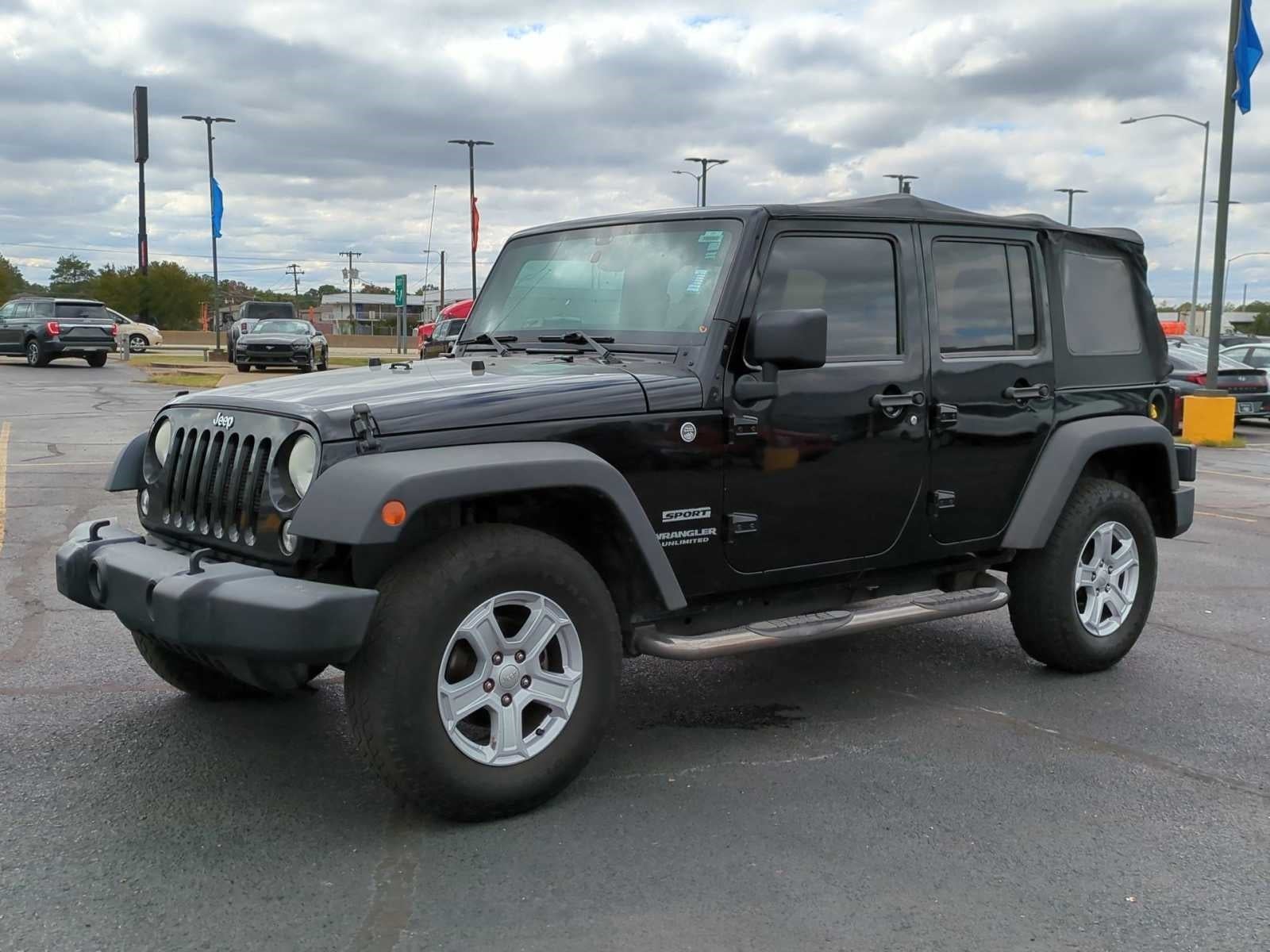 Used 2014 Jeep Wrangler Unlimited Sport with VIN 1C4BJWDG5EL133150 for sale in West Memphis, AR